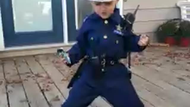 Tot Boy In Police Uniform Puts On Hilarious Dance Performance