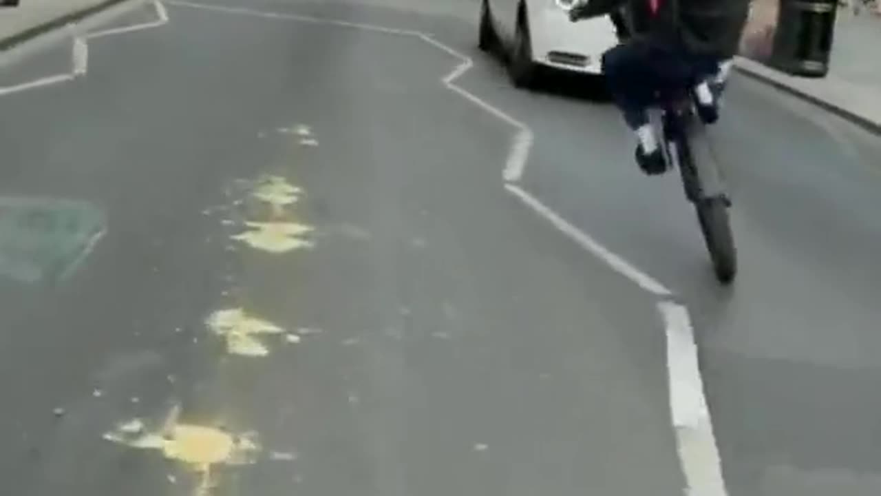 Dude does a wheelie in traffic and finds out