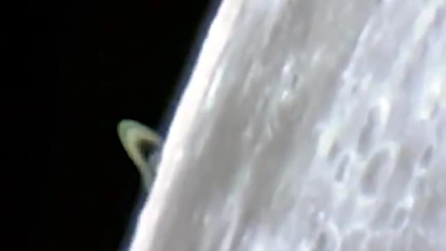 Saturn rising behind the moon