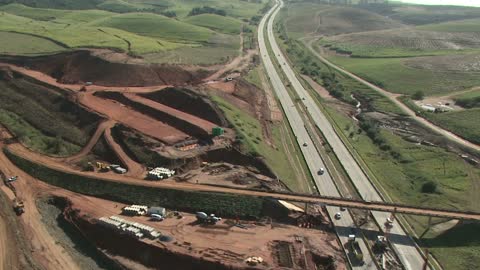 Helicopter Flying Over Highway Construction Site