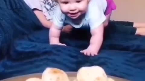 baby eating cheese bread ..