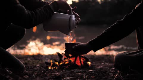 A wood fire during a campground at sunset