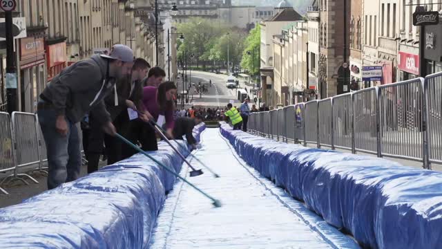 Artist Turns A Central Street In Bristol Into A Giant Water Slide