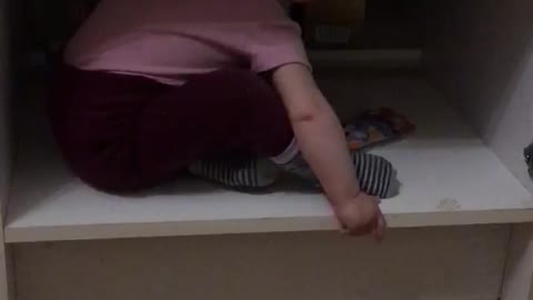 Baby crawls out of the closet