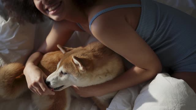 Woman Teasing Her Dog