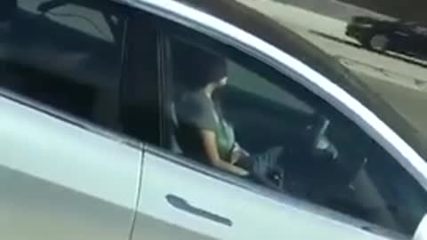 Tesla driver sleeping on road