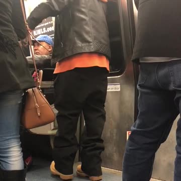 Leather jacket man dances into window on subway