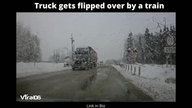 Truck gets flipped over by train nearly hitting a car