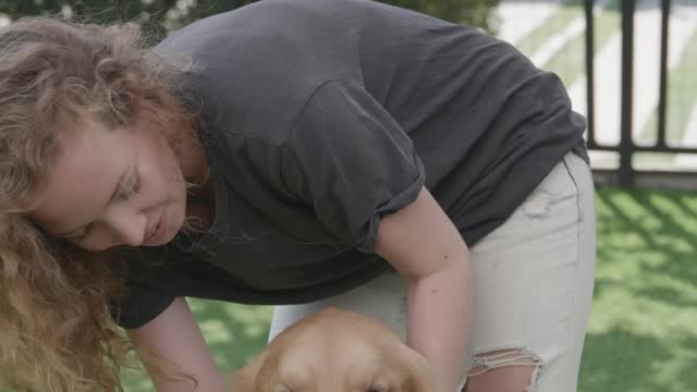 Woman Petting a Dog