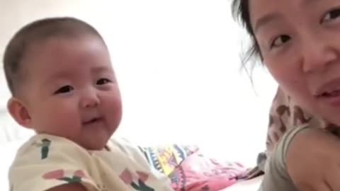 Funny baby and mom