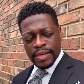 Aisa - Zoo Keepers holding a baby Dinosaur