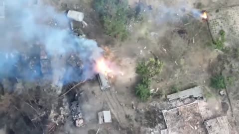 Ukrainian drone correcting artillery on Russian vehicles