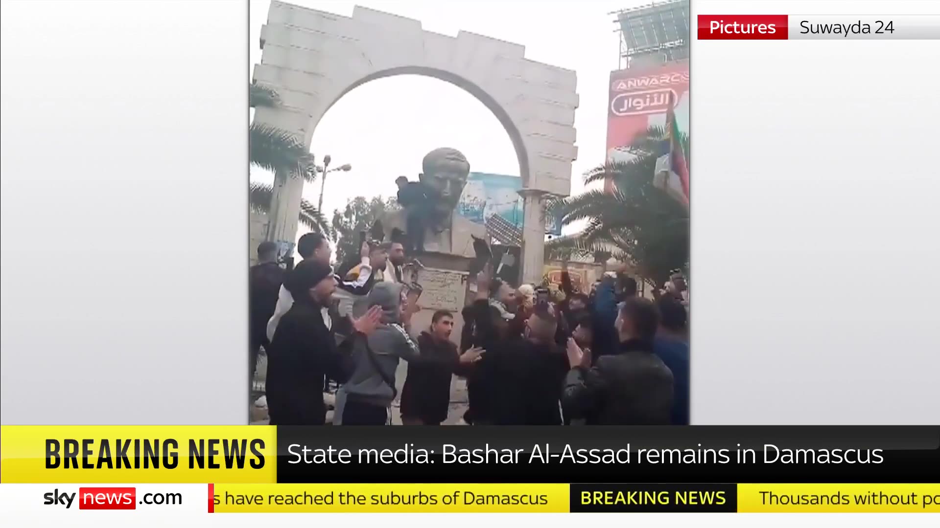 BREAKING: Syrian rebel forces 'reach Damascus suburbs' as protesters topple statue on outskirts