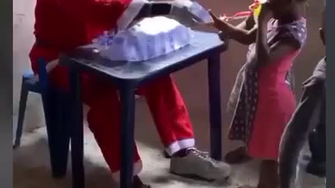 Father Christmas giving out sach