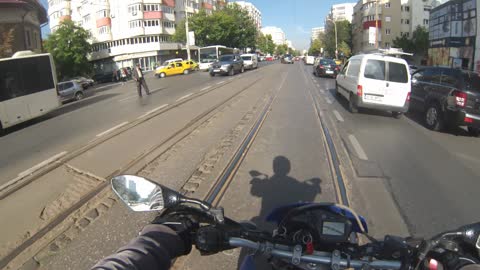 Biker Helps Senior Citizen Cross the Street