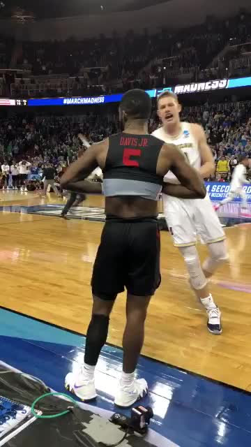 Michigan Player consoles stunned Houston Cougar player in NCAA Tournament