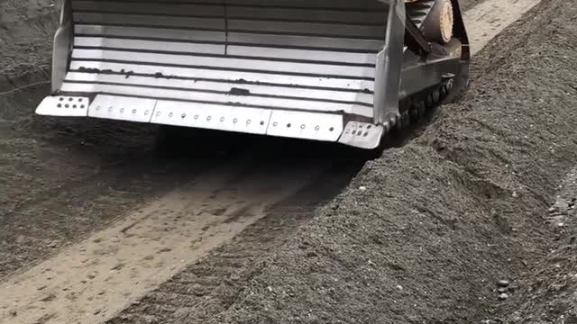 Sandhill Materials D8 pushing aggregate off the infamous “Sandhill” in slot dozing fashion