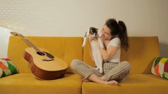 Adorable domestic animal concept. Young beautiful Asian woman relaxing