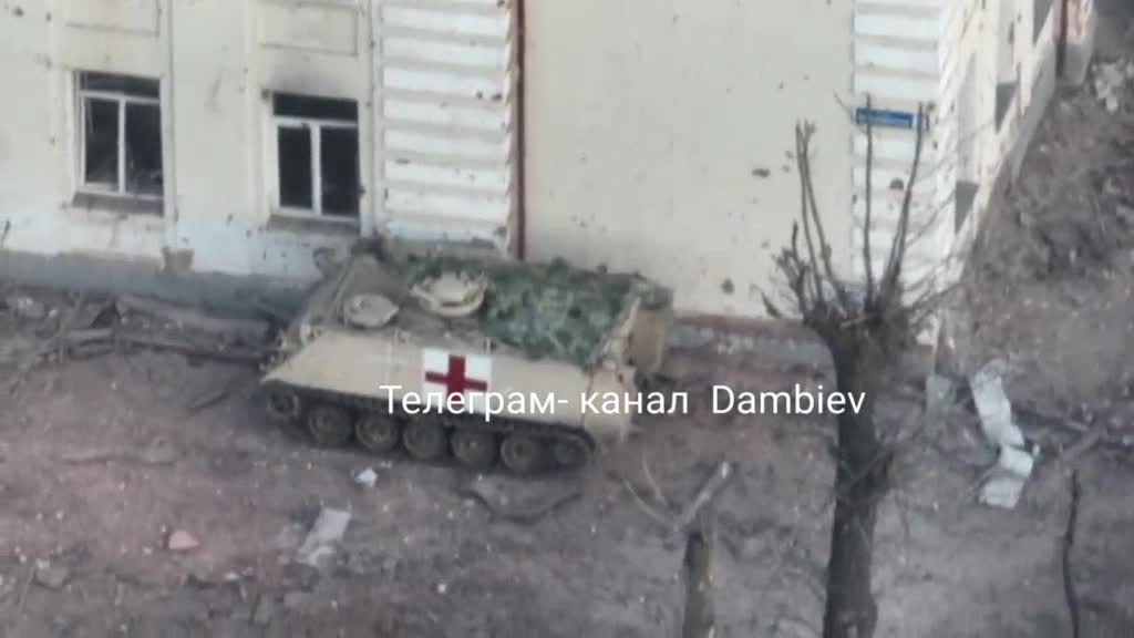 Medical M113 evacuates wounded soldiers from a house that was treated by Russian artillery