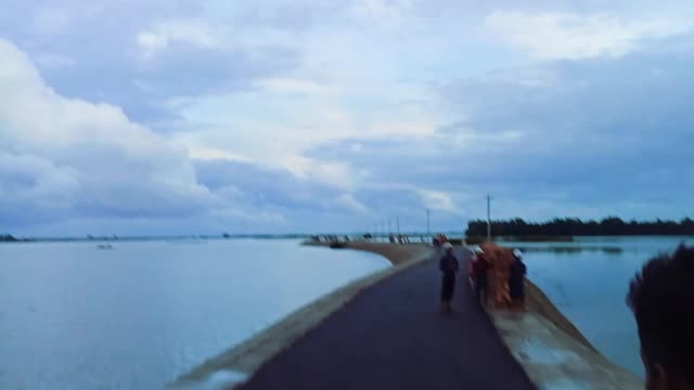 Road over water. Water on both sides.