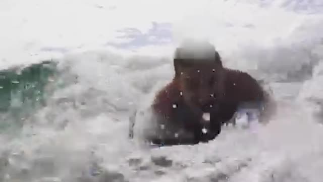 Man in blue boogie board crashed into camera