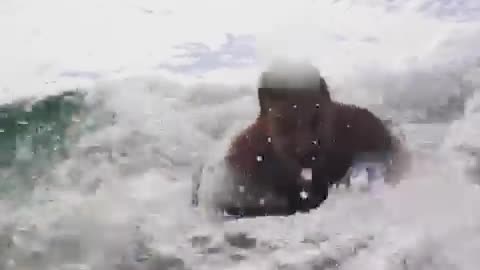 Man in blue boogie board crashed into camera