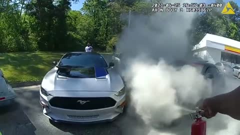 watch Police officers save man in burning car