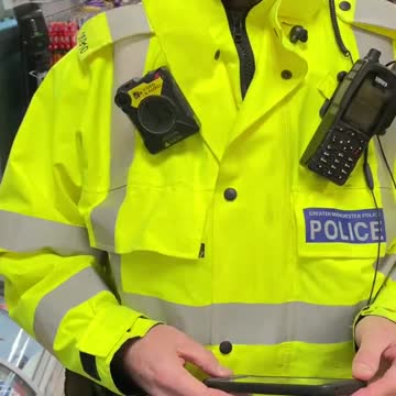 Police trying to arrest a man in Manchester for not wearing a face mask