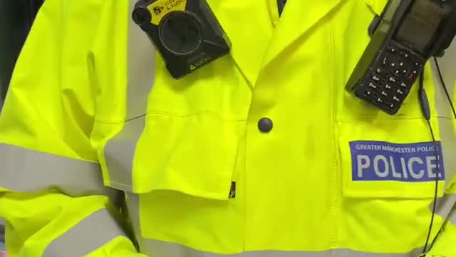 Police trying to arrest a man in Manchester for not wearing a face mask