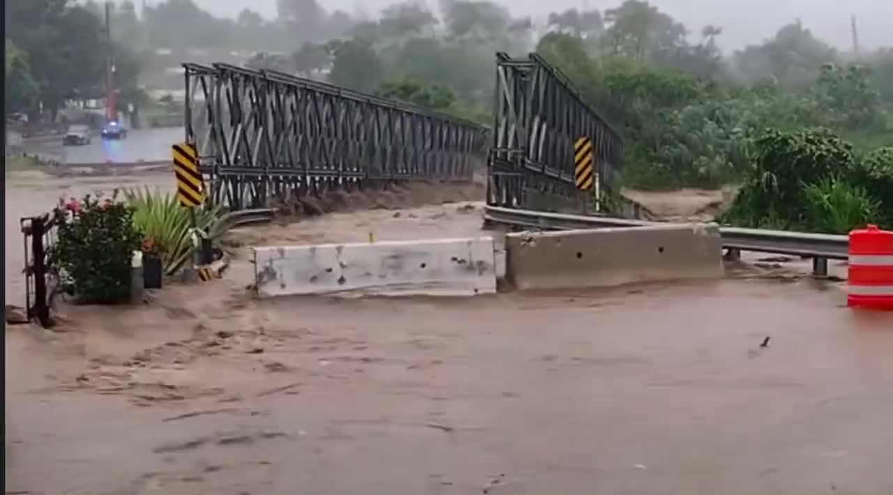 a Bridge was swept away by flooding in Puerto Rico caused by Hurricane Fiona.