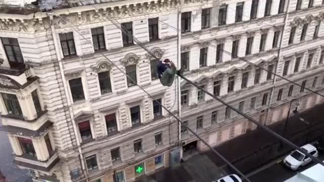 Daredevil Exercises Daily On TV Cables Above Street