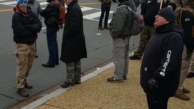 Agitator at the Capital moments before fence is breached