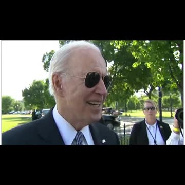 Biden looks at a little girls