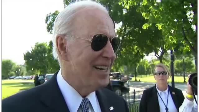 Biden looks at a little girls