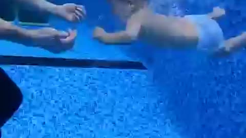 Cute baby and the swimming pool