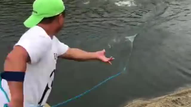 Fishing by net in small river