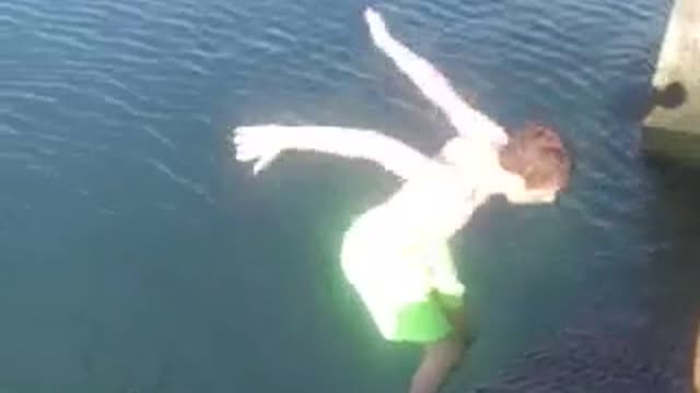 Green shorts on stairs does backflip into water faceplants