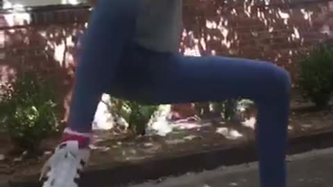 Girl in grey shirt hangs from branch that snaps