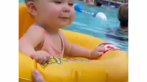 Cute baby girl swimming and having fun 😀