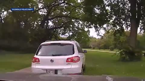 Police chase through park.