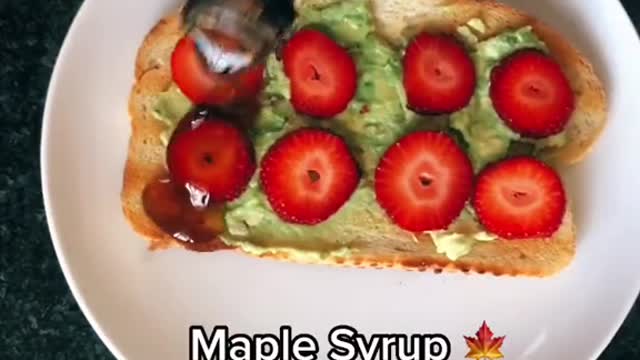 Strawberries and syrup avocado toast