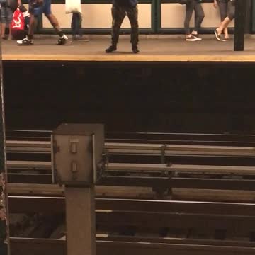 Man in denim jacket and backpack dancing