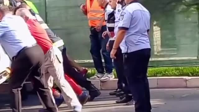 Push the overturned car right