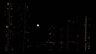 2011-06-20 Moonrise among buildings 01