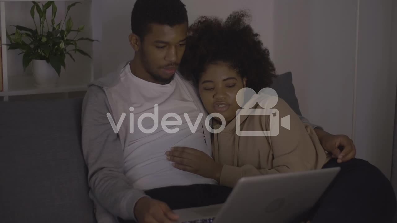 Young Couple Watching A Movie On The Laptop 1