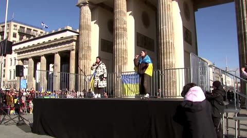 Pro-Ukraine protestors rally on war anniversary