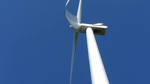 Standing under a windmill