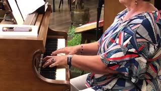 Claudia Vining plays piano at Warner Hall