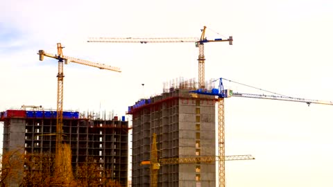 Cranes on building construction site