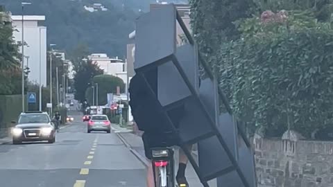 Cyclist Carries Shelves on Bike